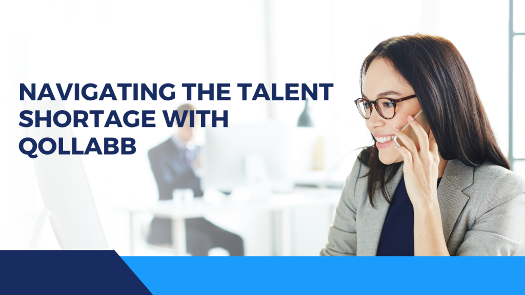 A professional woman smiling and talking on the phone in an office setting, representing the use of Qollabb for navigating talent shortages.